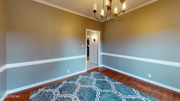 a kitchen with granite countertop a refrigerator and stove