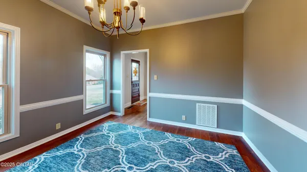 a view of a chandelier in big room and a chandelier