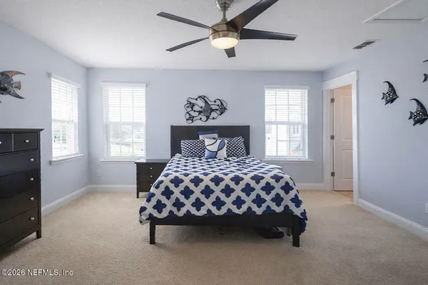 a living room with furniture window and flat screen tv