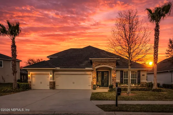 a view of a house with a yard
