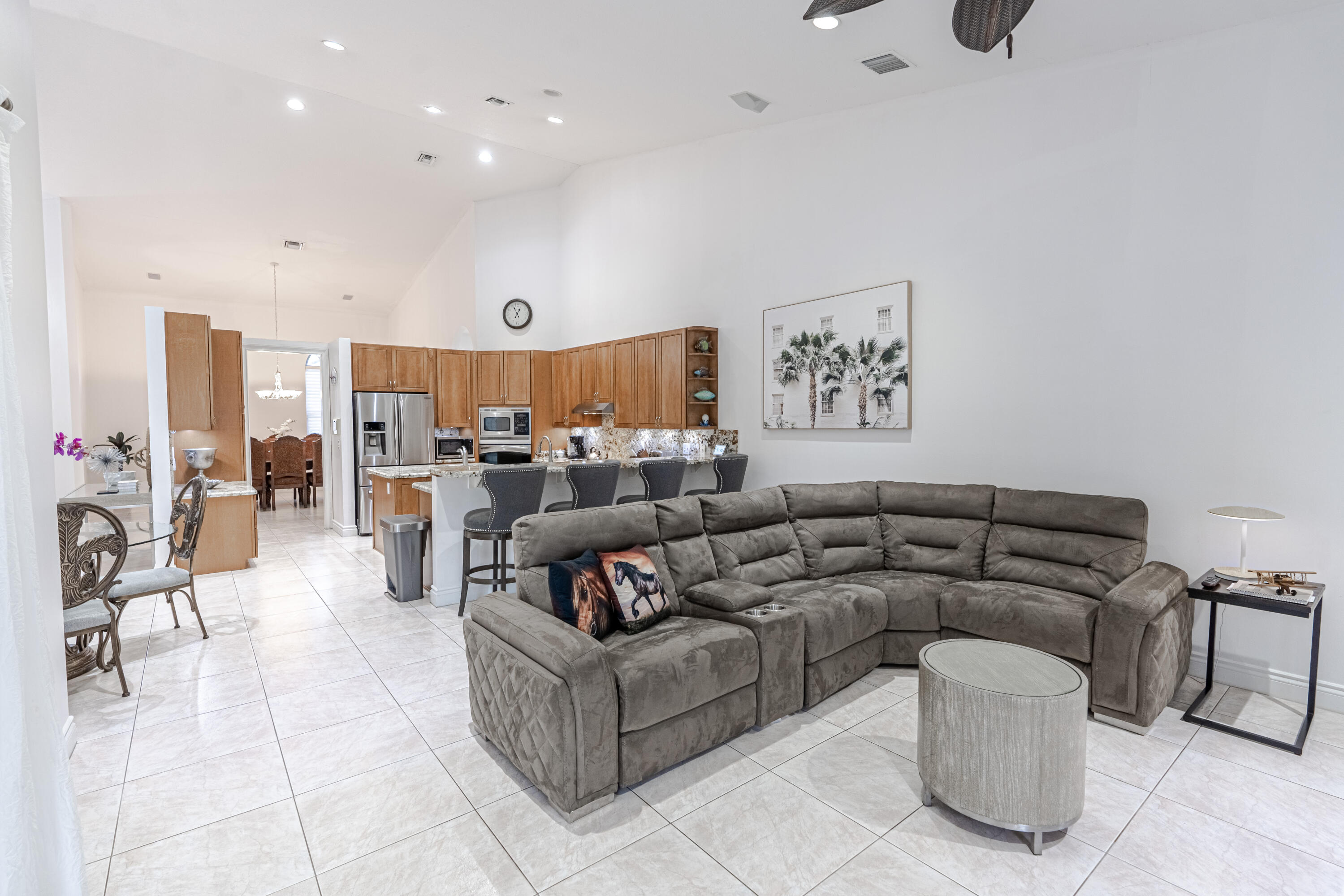15350 Take Off Place Wellington, FL 33414 - Photo 12 of 44 a living room with furniture and kitchen view