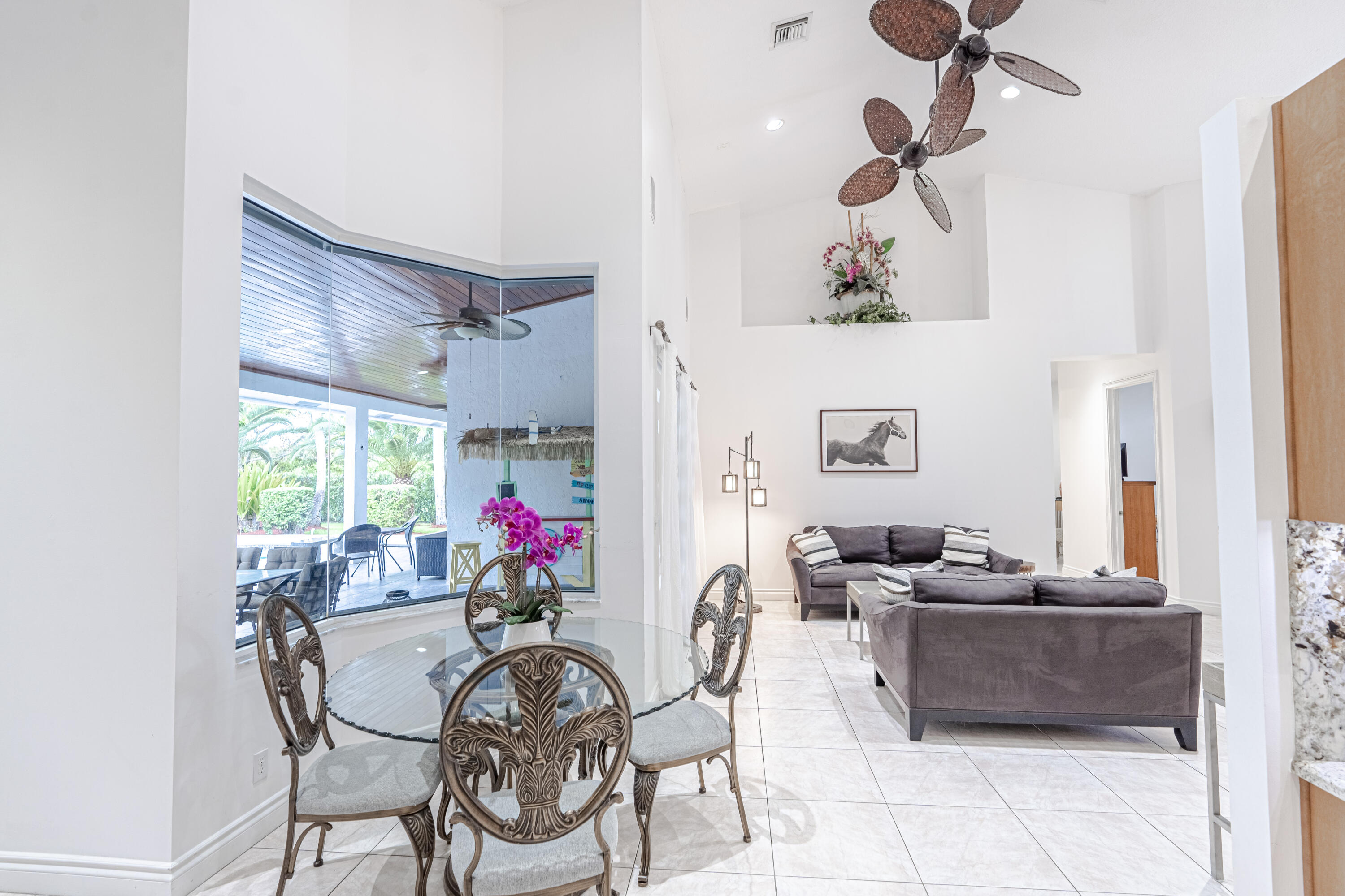 15350 Take Off Place Wellington, FL 33414 - Photo 13 of 44 a view of a dining room with furniture window and outside view