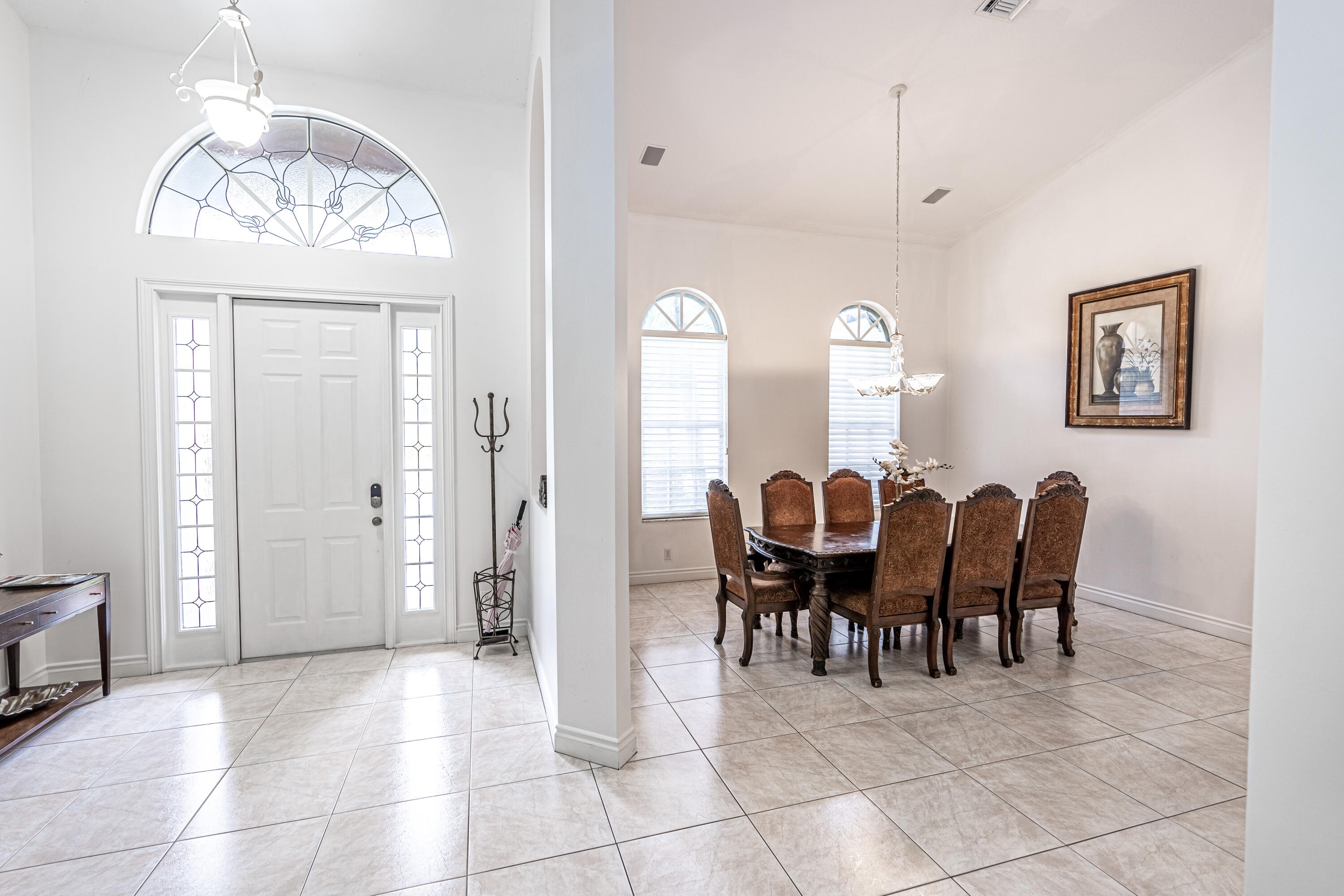 15350 Take Off Place Wellington, FL 33414 - Photo 14 of 44 a view of a dining room with furniture