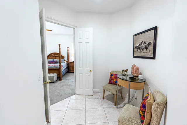 a living room with furniture and a bed