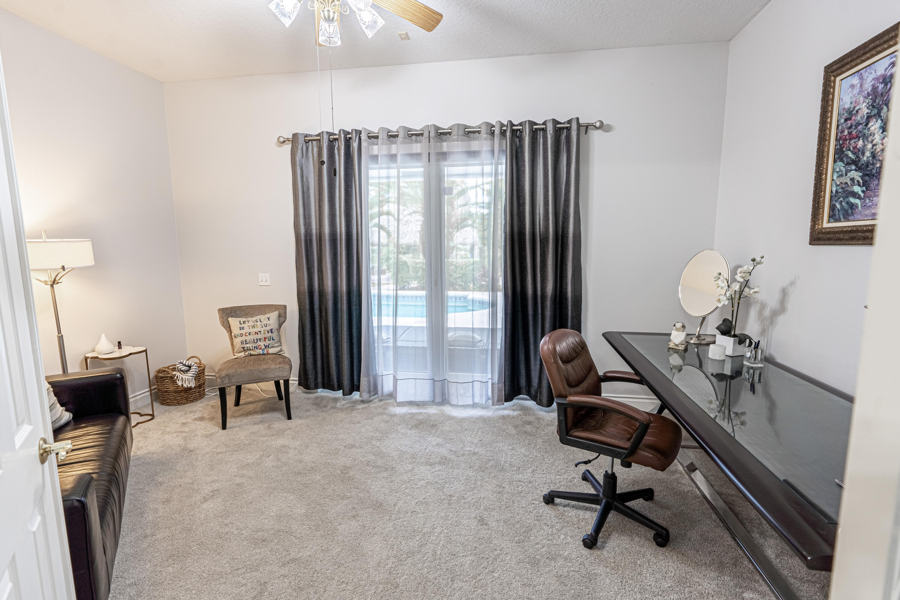 15350 Take Off Place Wellington, FL 33414 - Photo 18 of 44 a view of a workspace with furniture and a window