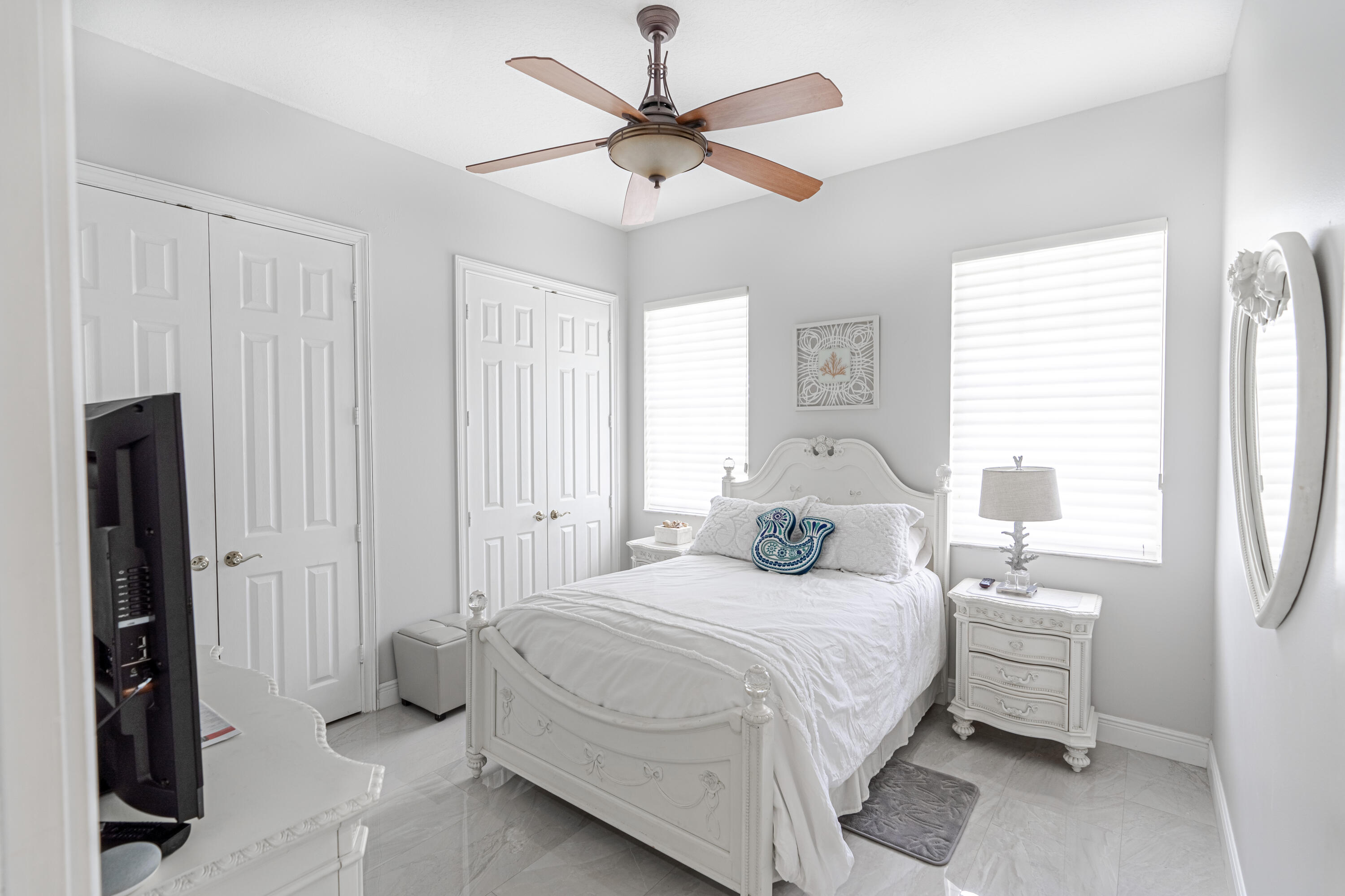 15350 Take Off Place Wellington, FL 33414 - Photo 26 of 44 a bedroom with a bed and a window