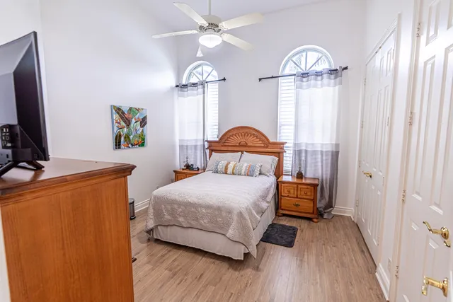 a bedroom with a bed and a chandelier