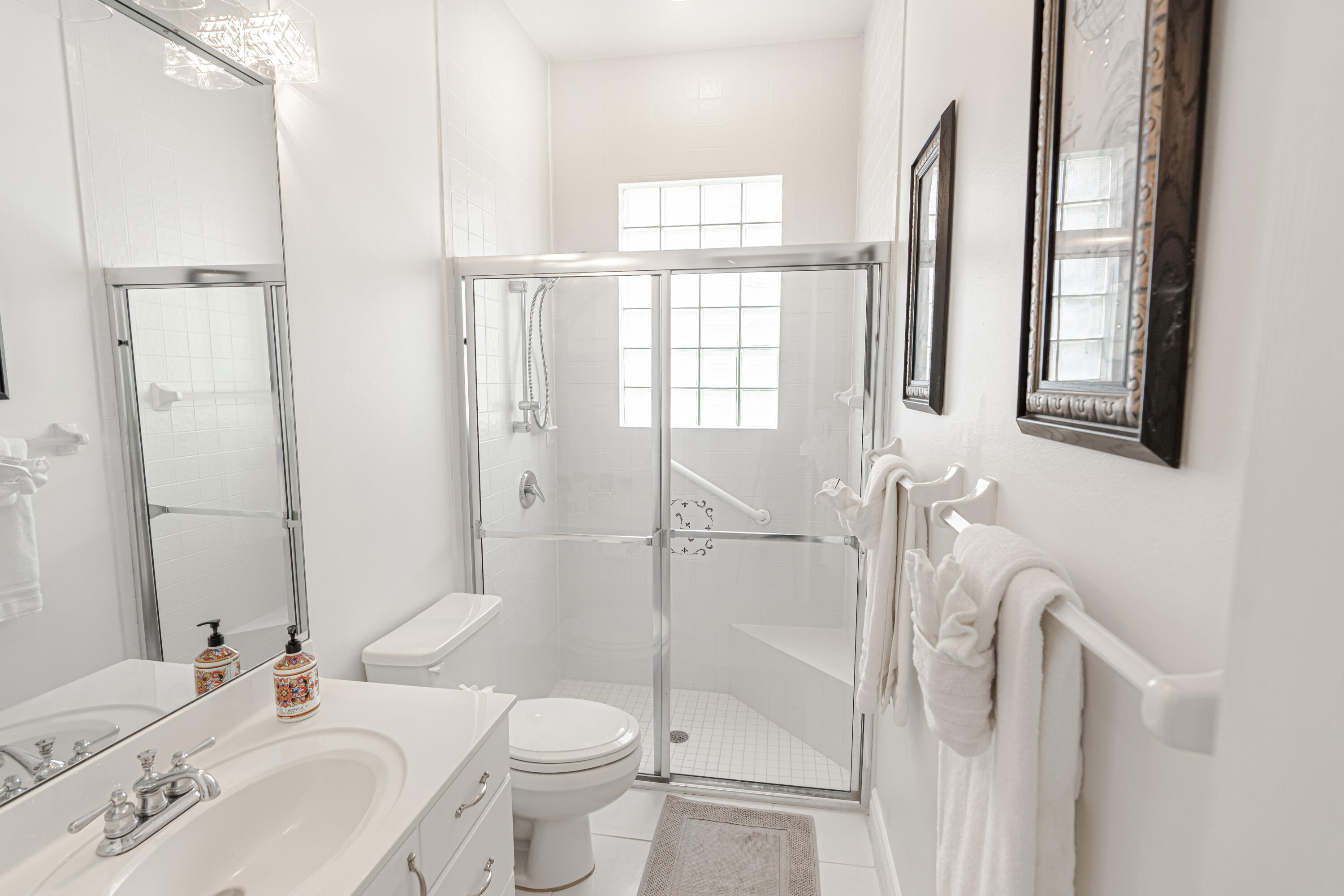 15350 Take Off Place Wellington, FL 33414 - Photo 34 of 44 a bathroom with a sink toilet and shower