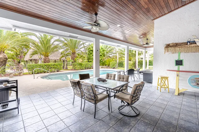 a view of a swimming pool with a patio