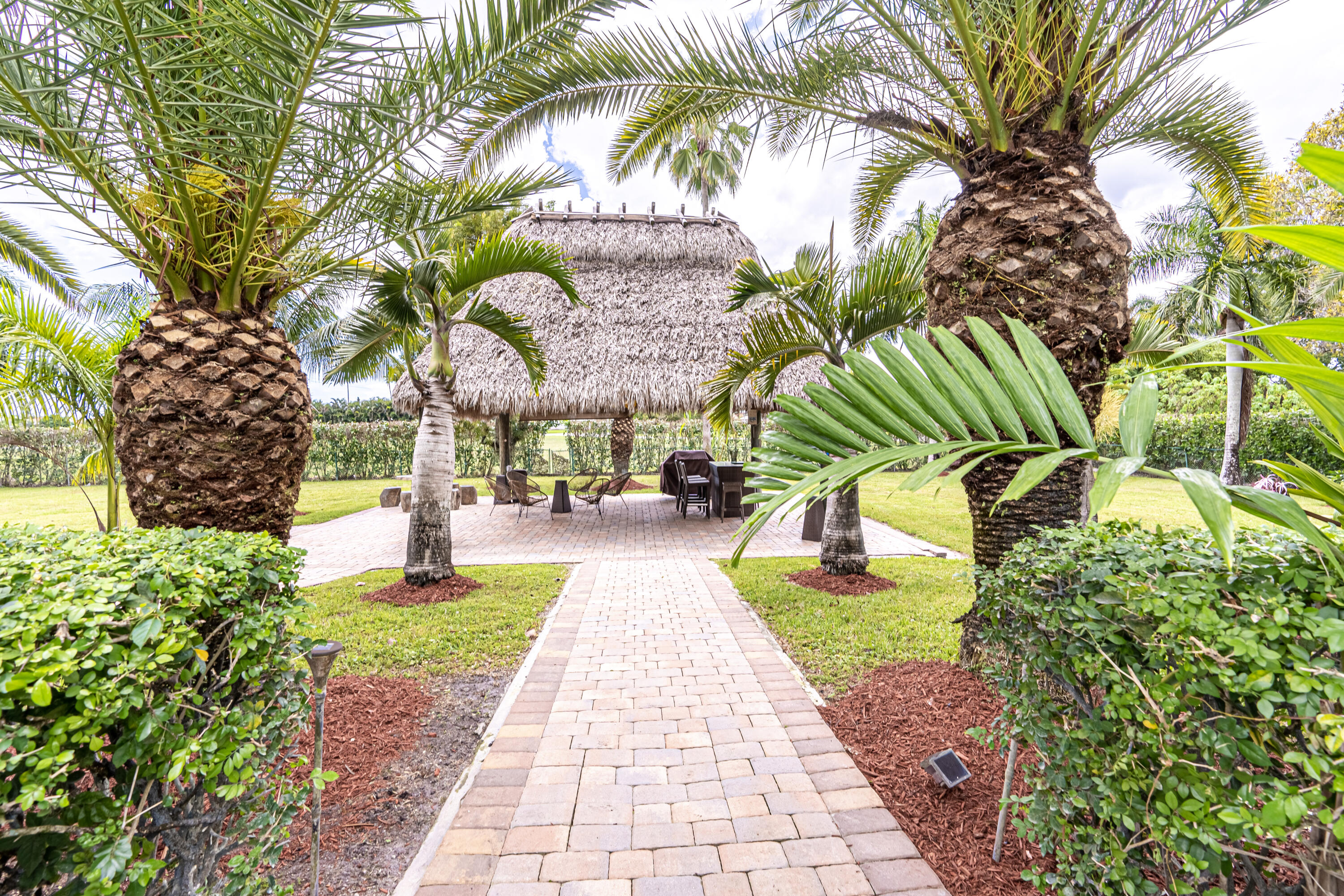 15350 Take Off Place Wellington, FL 33414 - Photo 39 of 44 a view of yard with swimming pool and sitting area