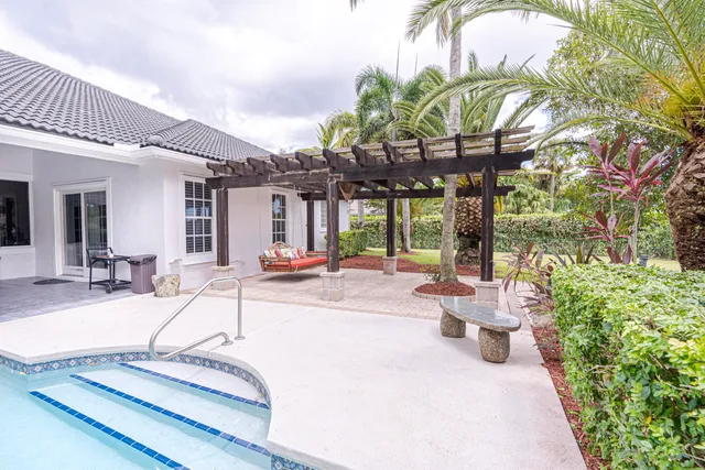 a view of a patio with swimming pool