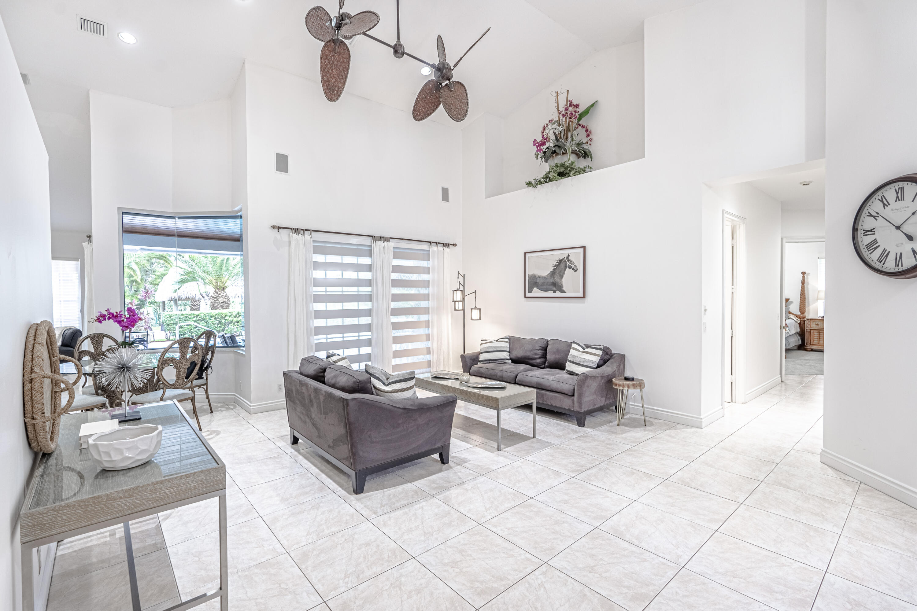 15350 Take Off Place Wellington, FL 33414 - Photo 4 of 44 a living room with furniture and a large window