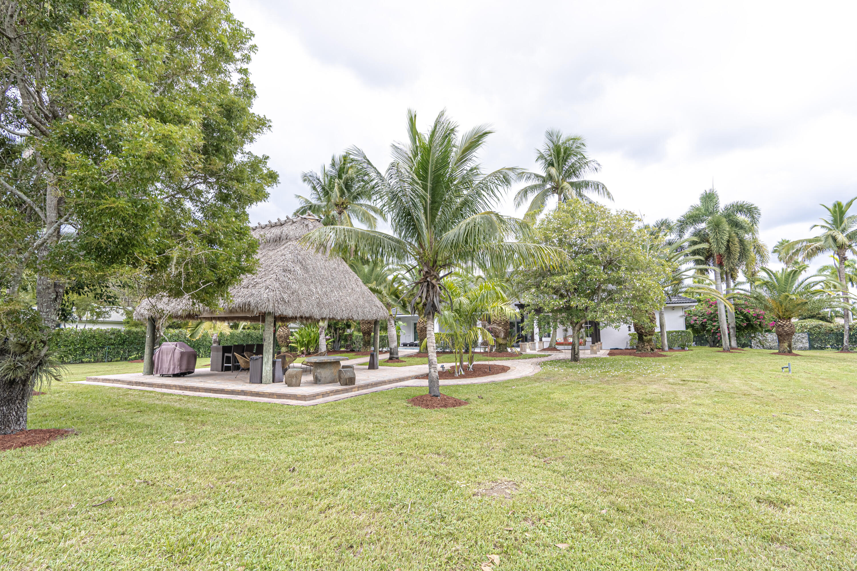 15350 Take Off Place Wellington, FL 33414 - Photo 42 of 44 a swimming pool with outdoor seating and yard