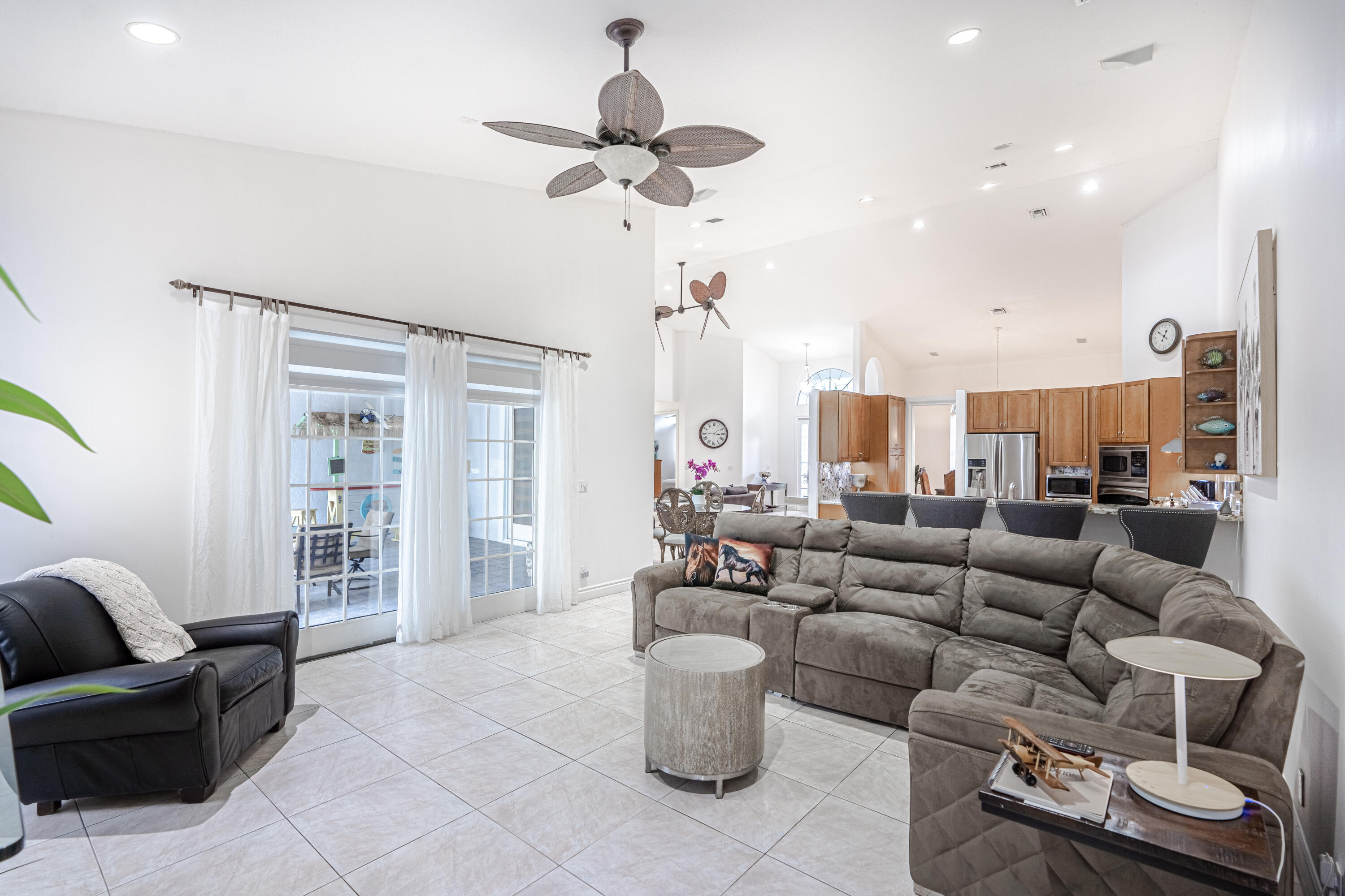 15350 Take Off Place Wellington, FL 33414 - Photo 9 of 44 a living room with furniture and a large window