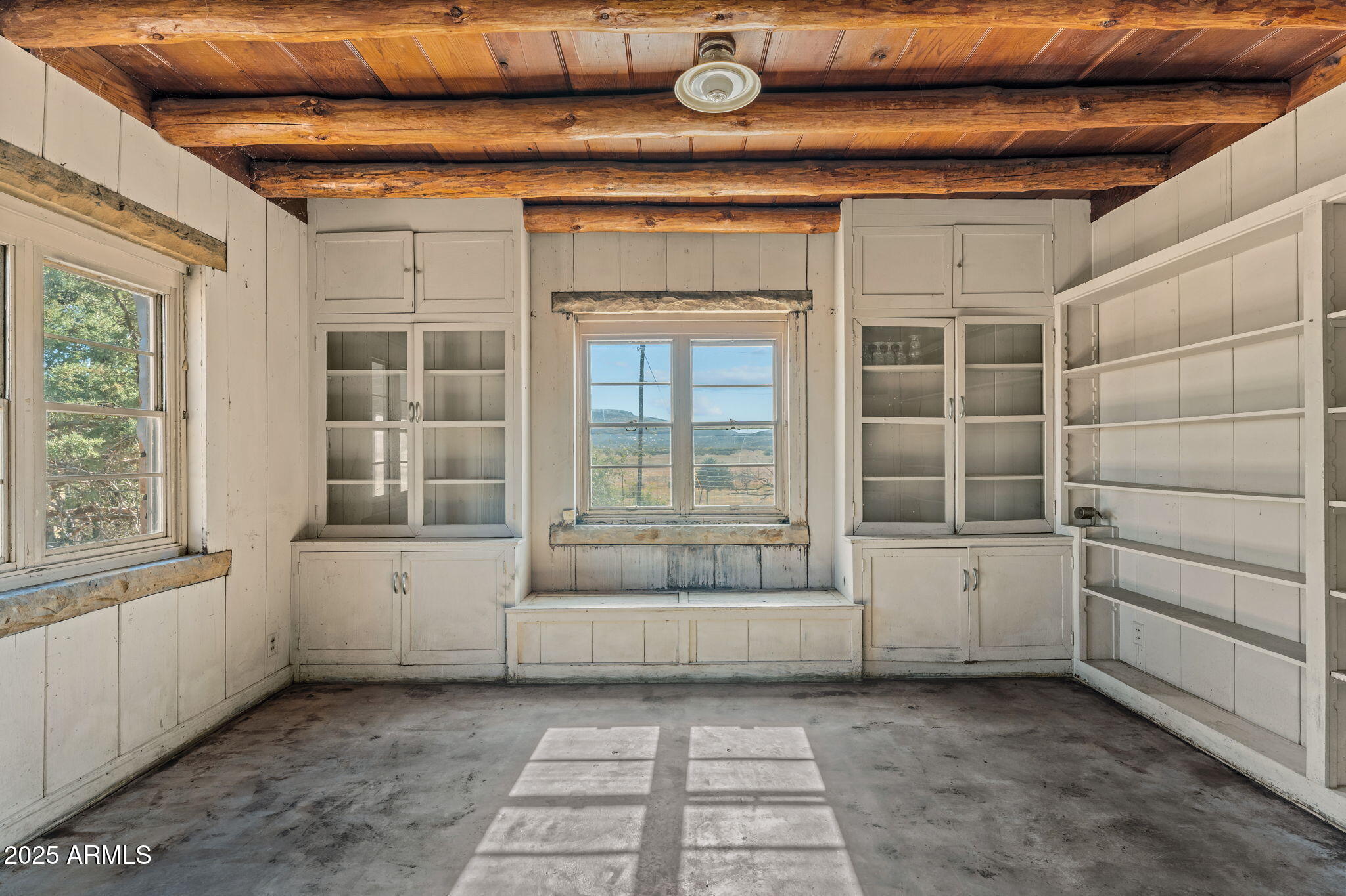 16057 Sickles Ranch Road Peeples Valley, AZ 86332 - Photo 11 of 40 a view of an empty room with a window