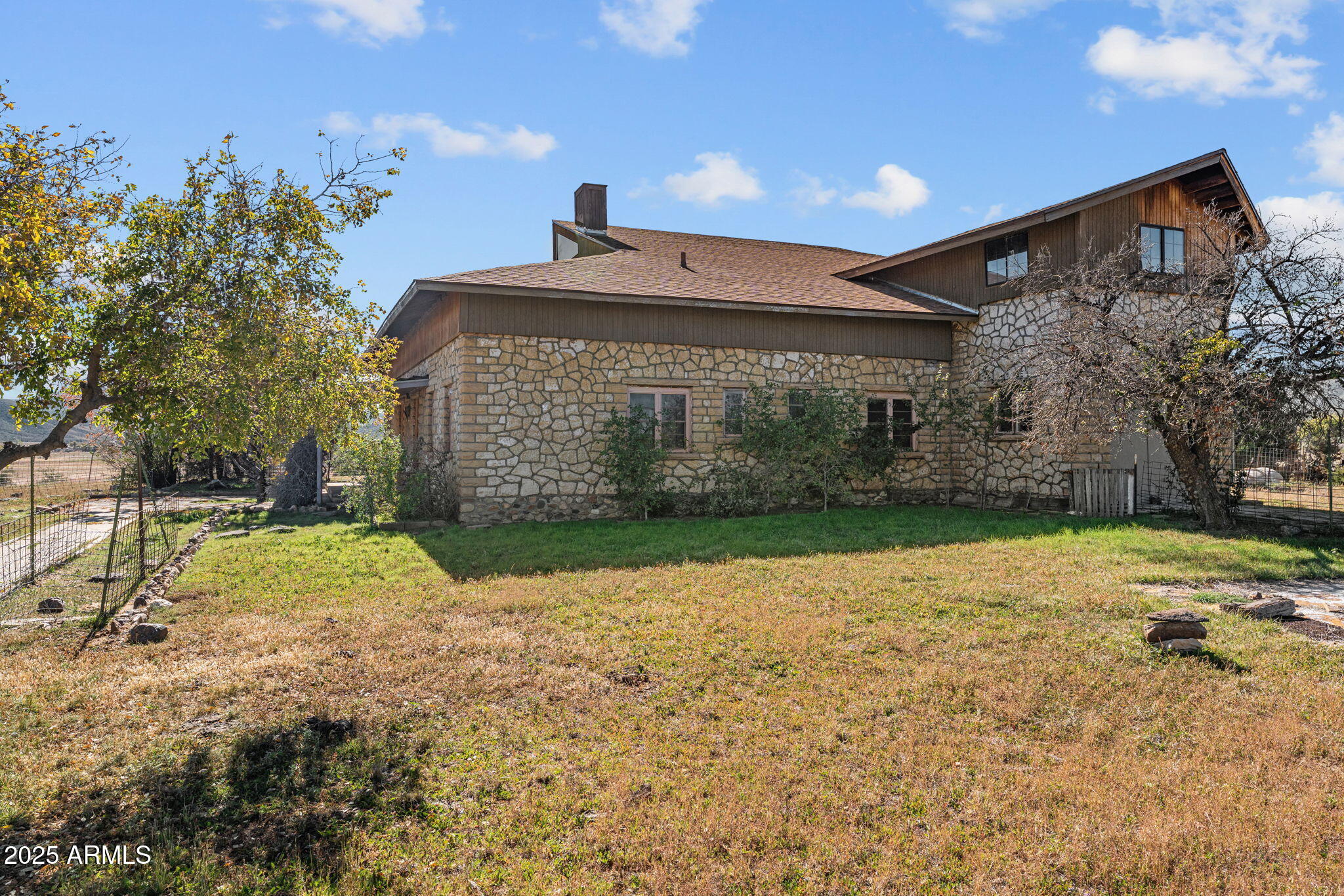 16057 Sickles Ranch Road Peeples Valley, AZ 86332 - Photo 2 of 40 a front view of a house with a yard