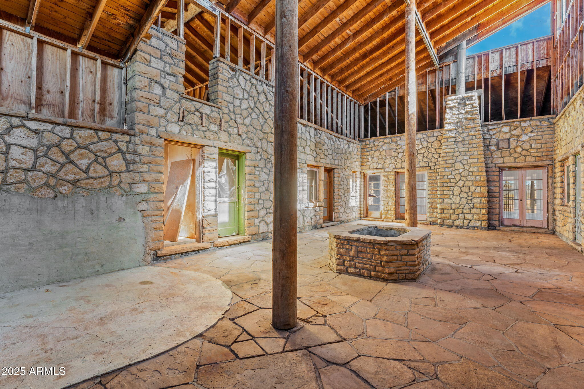 16057 Sickles Ranch Road Peeples Valley, AZ 86332 - Photo 3 of 40 a backyard of a house with barbeque oven