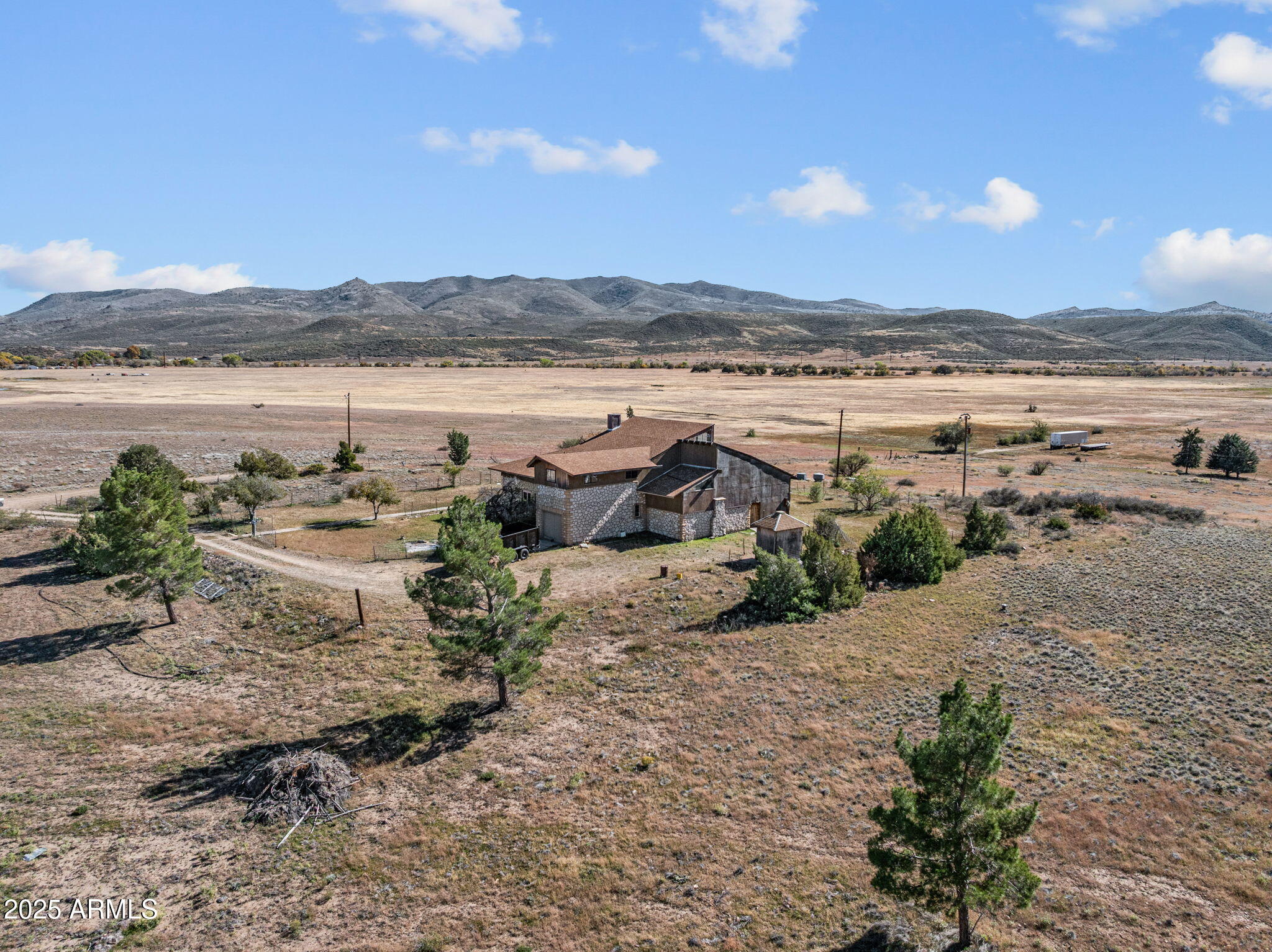 16057 Sickles Ranch Road Peeples Valley, AZ 86332 - Photo 37 of 40 a view of a lake with houses in the background
