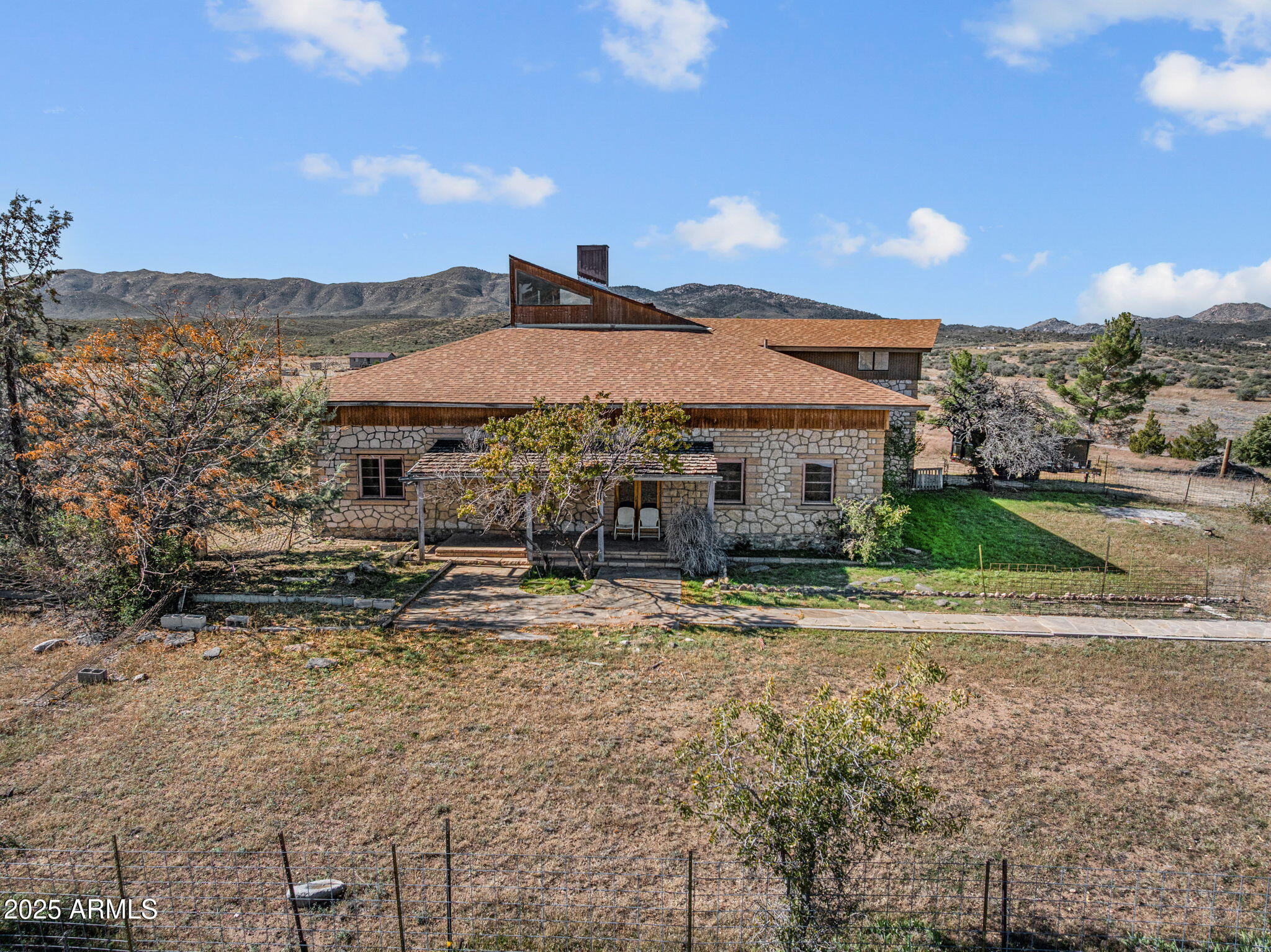 16057 Sickles Ranch Road Peeples Valley, AZ 86332 - Photo 4 of 40 a view of a house with a yard