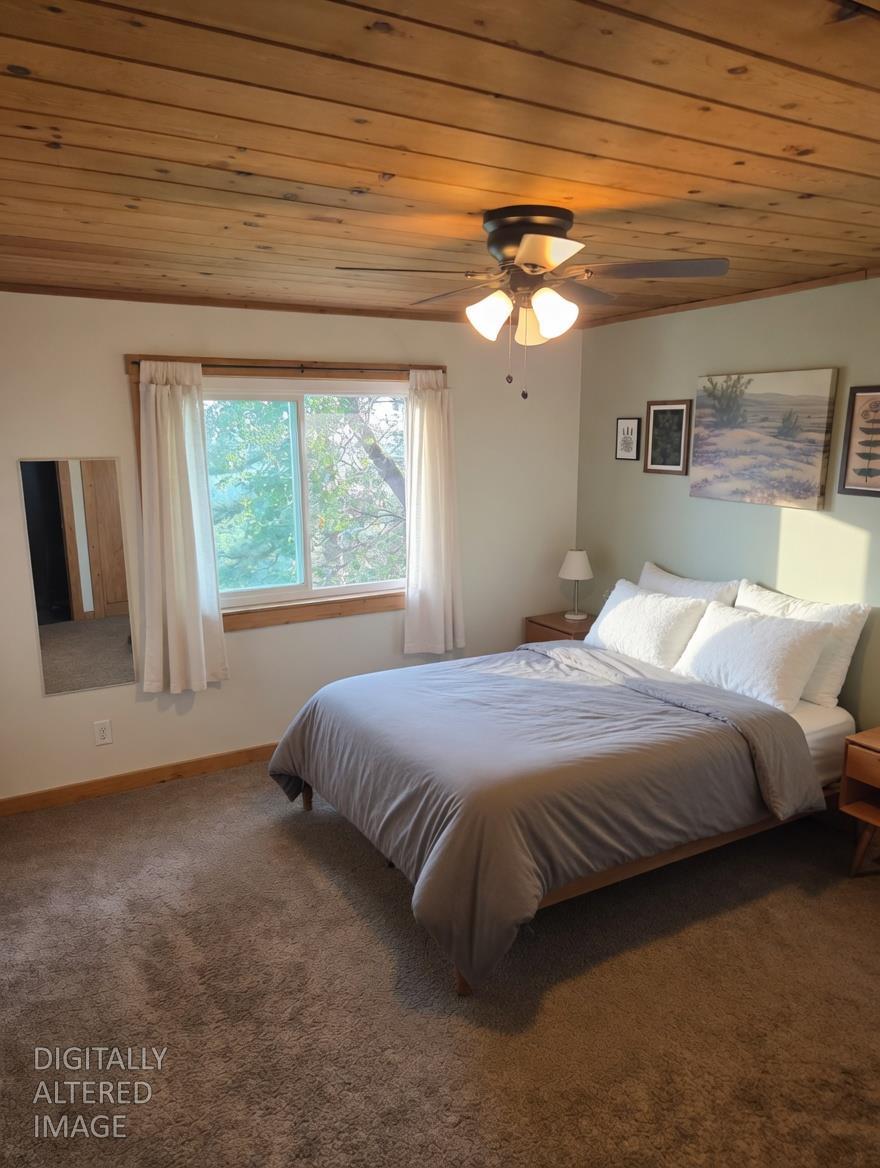 4850 8 Mile Road Camino, CA 95709 - Photo 12 of 30 a bedroom with a large bed and a window