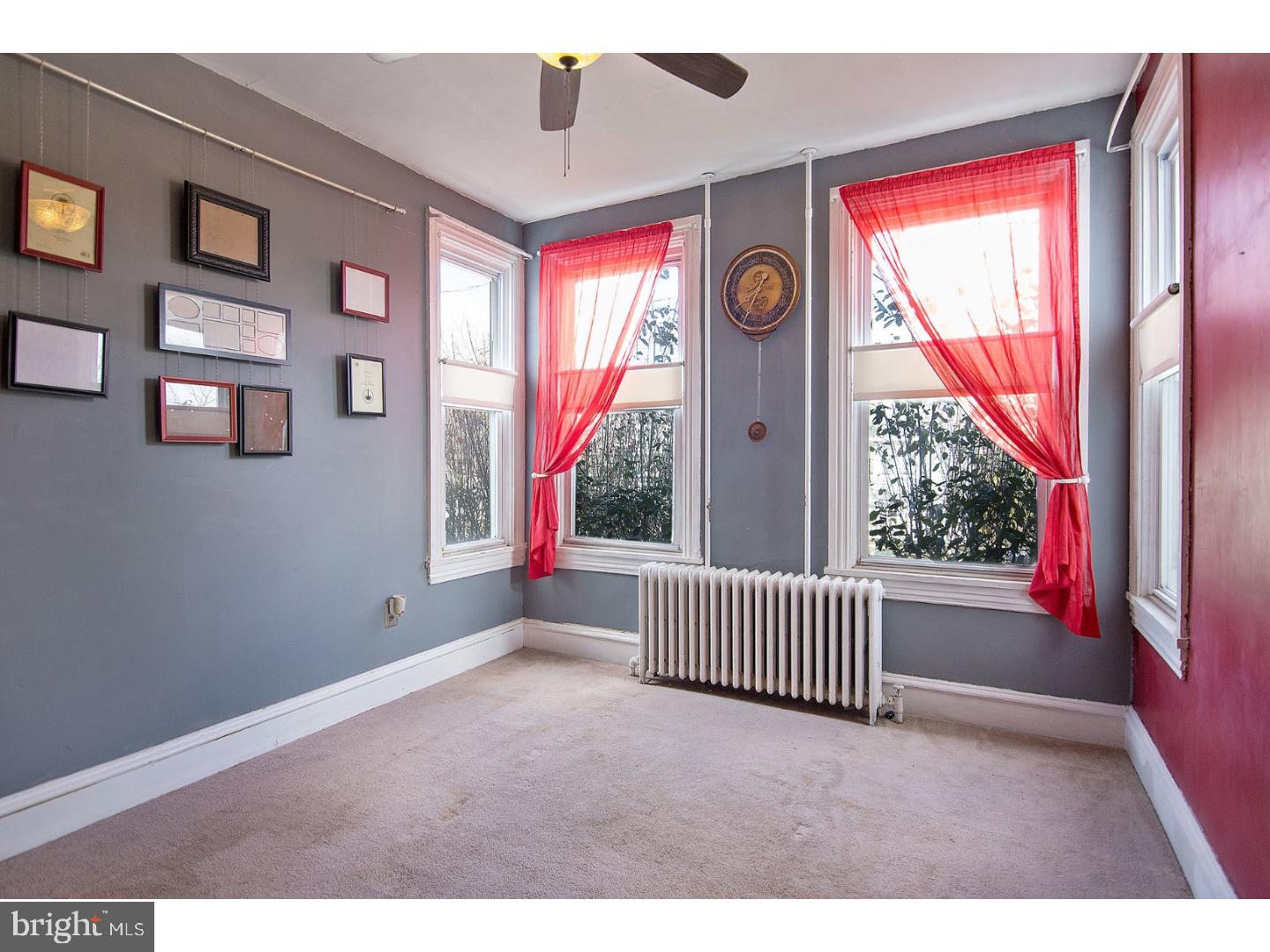 116 Warwick Road Magnolia, NJ 08049 - Photo 6 of 24 a view of empty room with windows