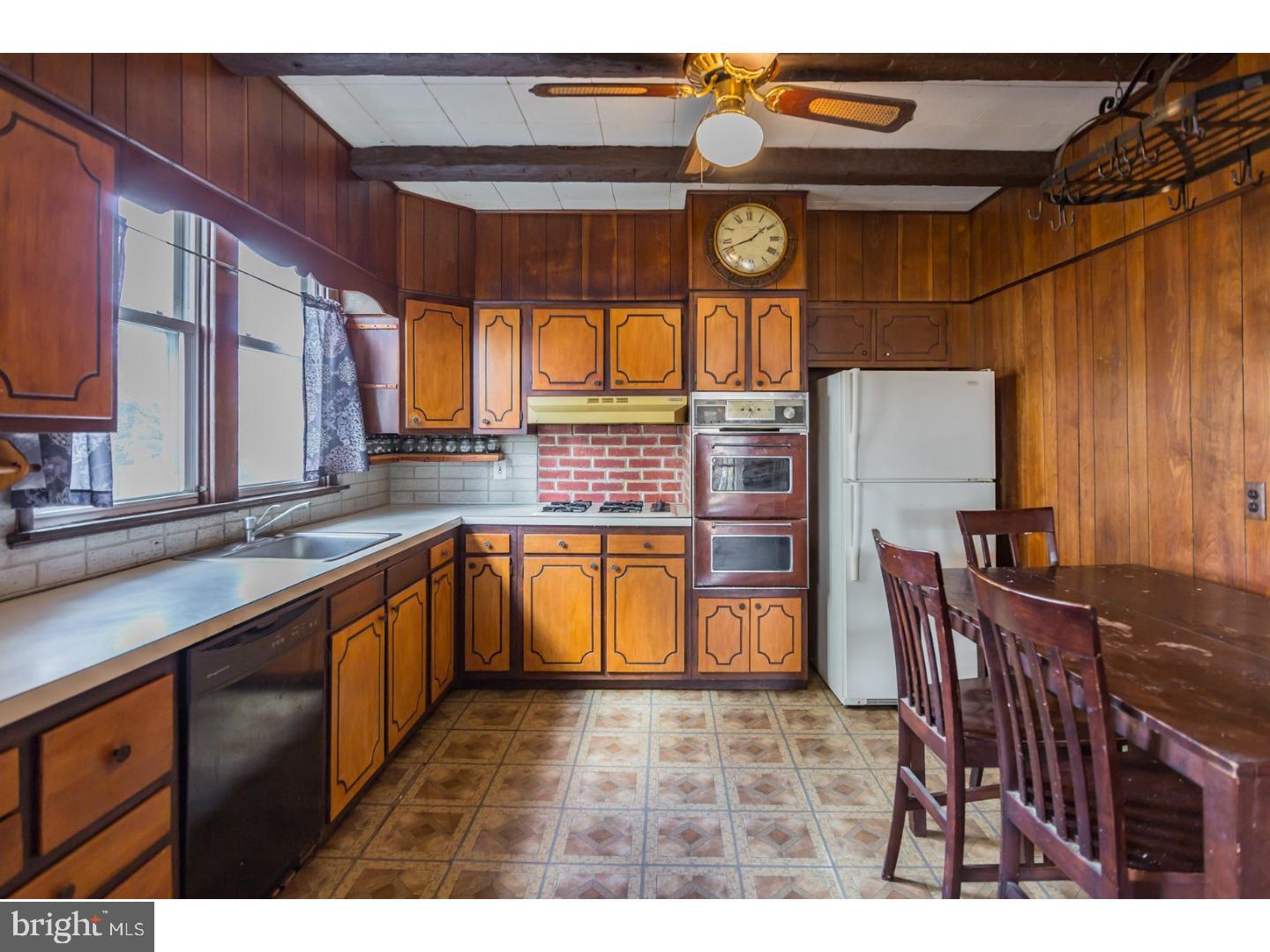 116 Warwick Road Magnolia, NJ 08049 - Photo 8 of 24 a open kitchen with stainless steel appliances granite countertop a stove and cabinets