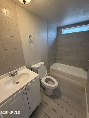a bathroom with a sink a toilet and a bathtub