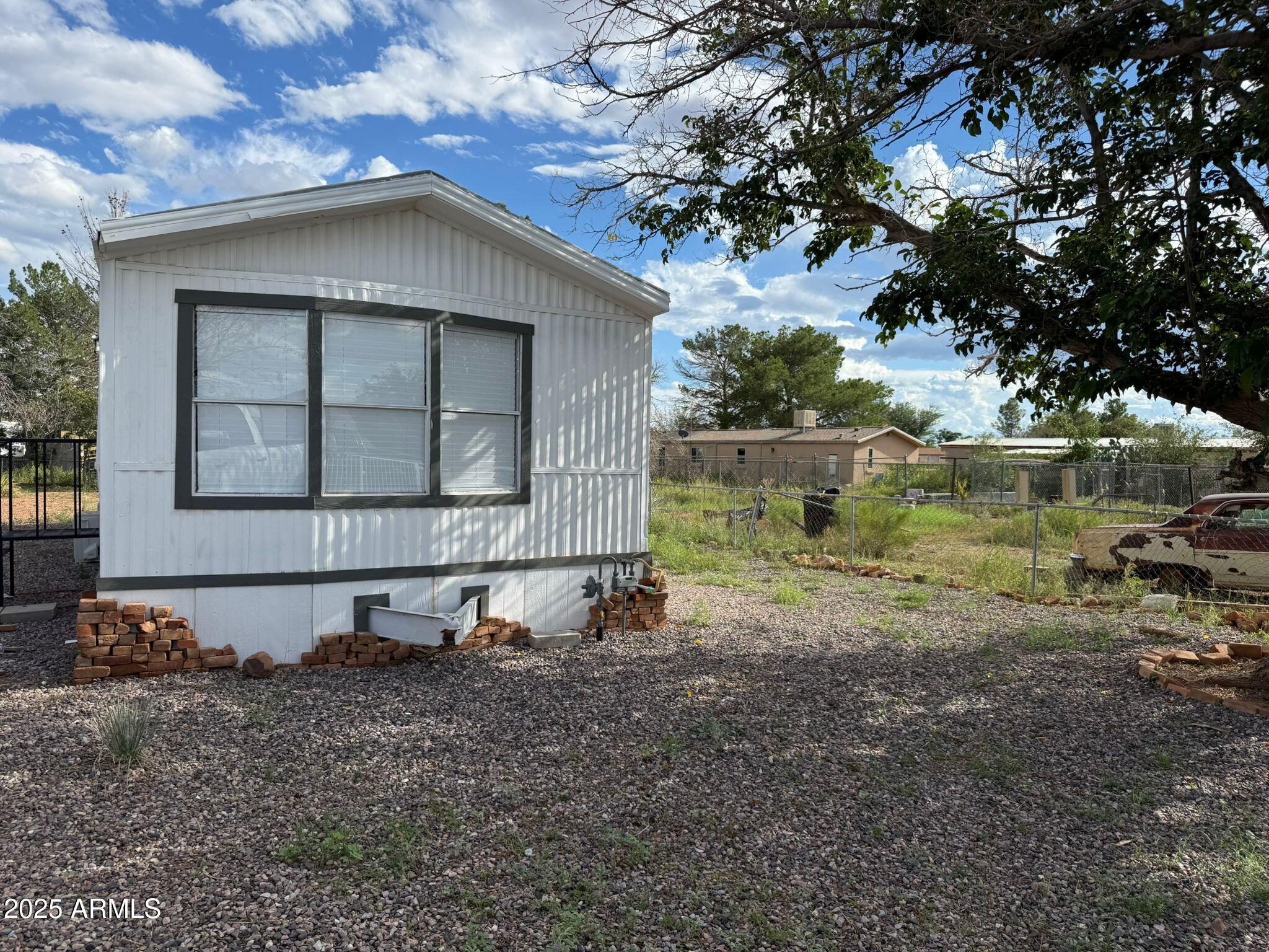2303 East Carnation Street Douglas, AZ 85607 - Photo 2 of 16 a small pool with a yard in the back