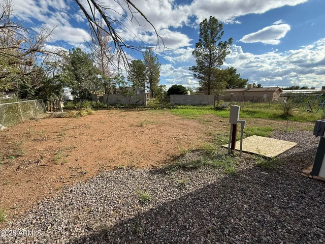 a view of a lake with a yard