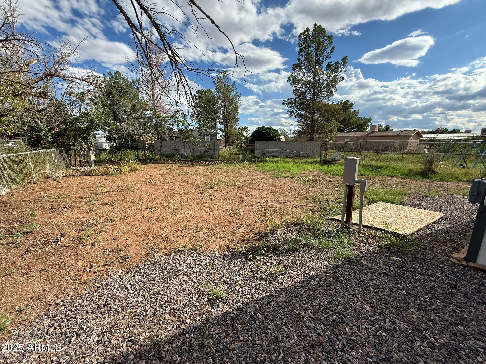 2303 East Carnation Street Douglas, AZ 85607 - Photo 4 of 16 a view of a lake with a yard
