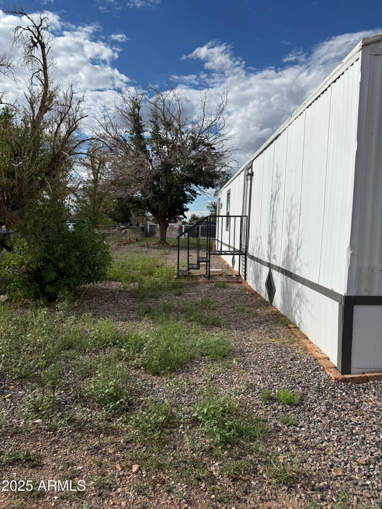2303 East Carnation Street Douglas, AZ 85607 - Photo 5 of 16 a view of backyard with deck and garden
