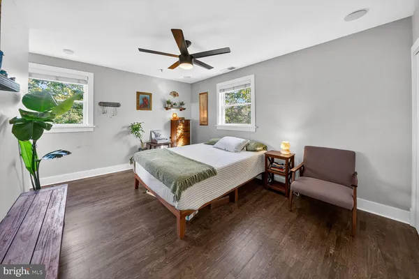 a bedroom with a bed and a couch