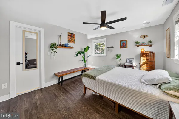 a bedroom with a bed and a dresser