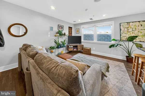 a bed room with a bed and a flat screen tv