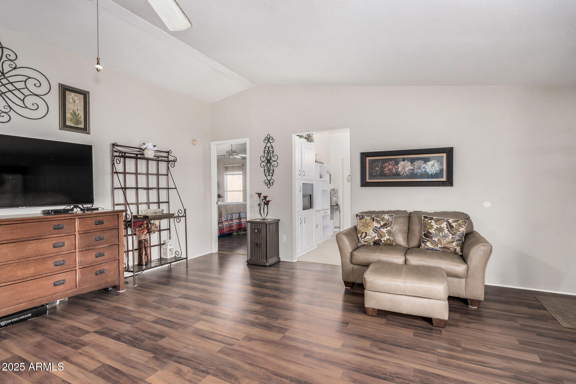 2208 West Baseline Avenue, Unit 114 Apache Junction, AZ 85120 - Photo 11 of 28 a living room with furniture and a flat screen tv