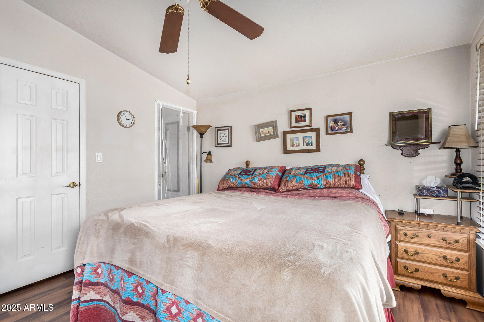 2208 West Baseline Avenue, Unit 114 Apache Junction, AZ 85120 - Photo 15 of 28 a bed room with a bed a couch and a window