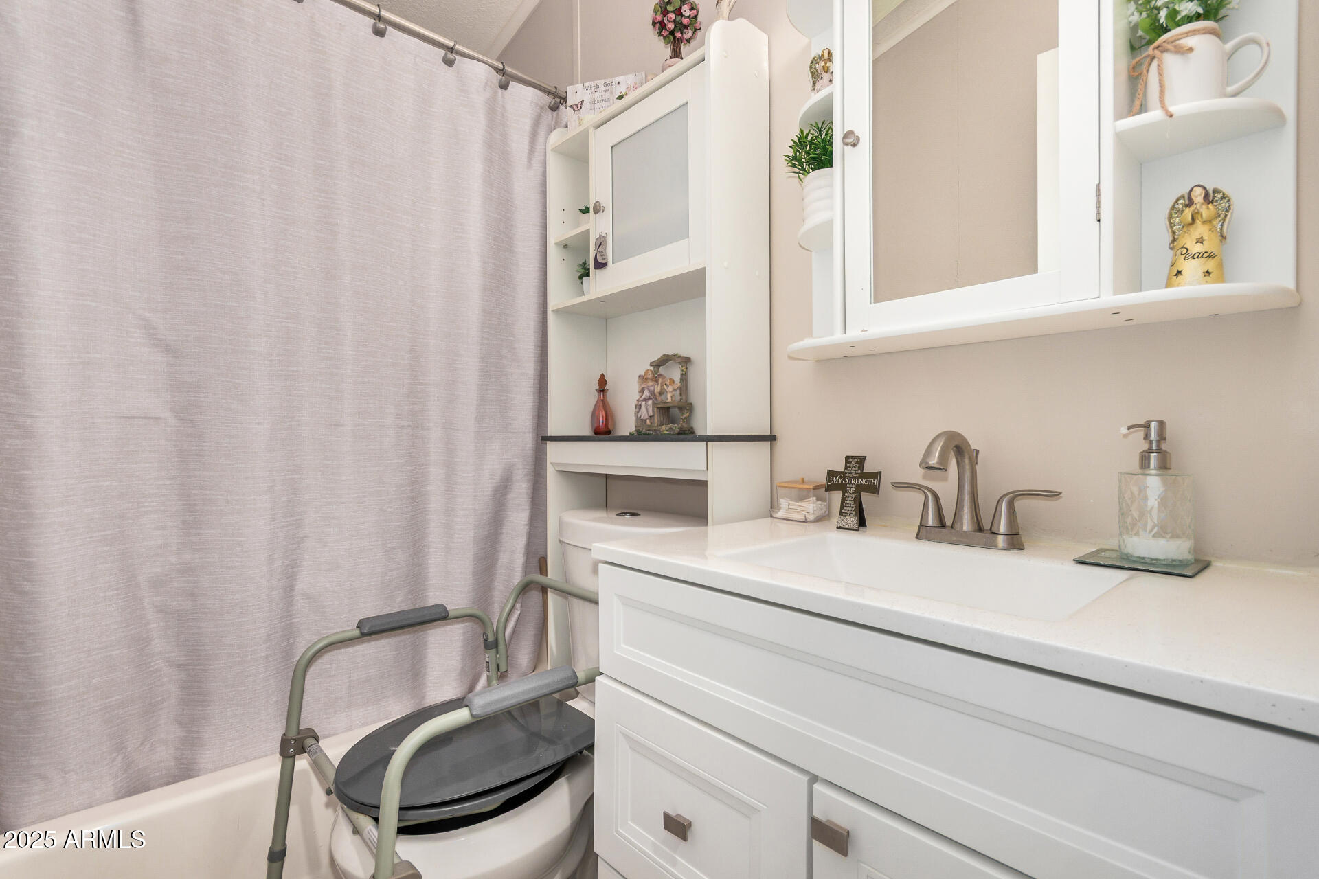 2208 West Baseline Avenue, Unit 114 Apache Junction, AZ 85120 - Photo 22 of 28 a bathroom with a sink and a mirror