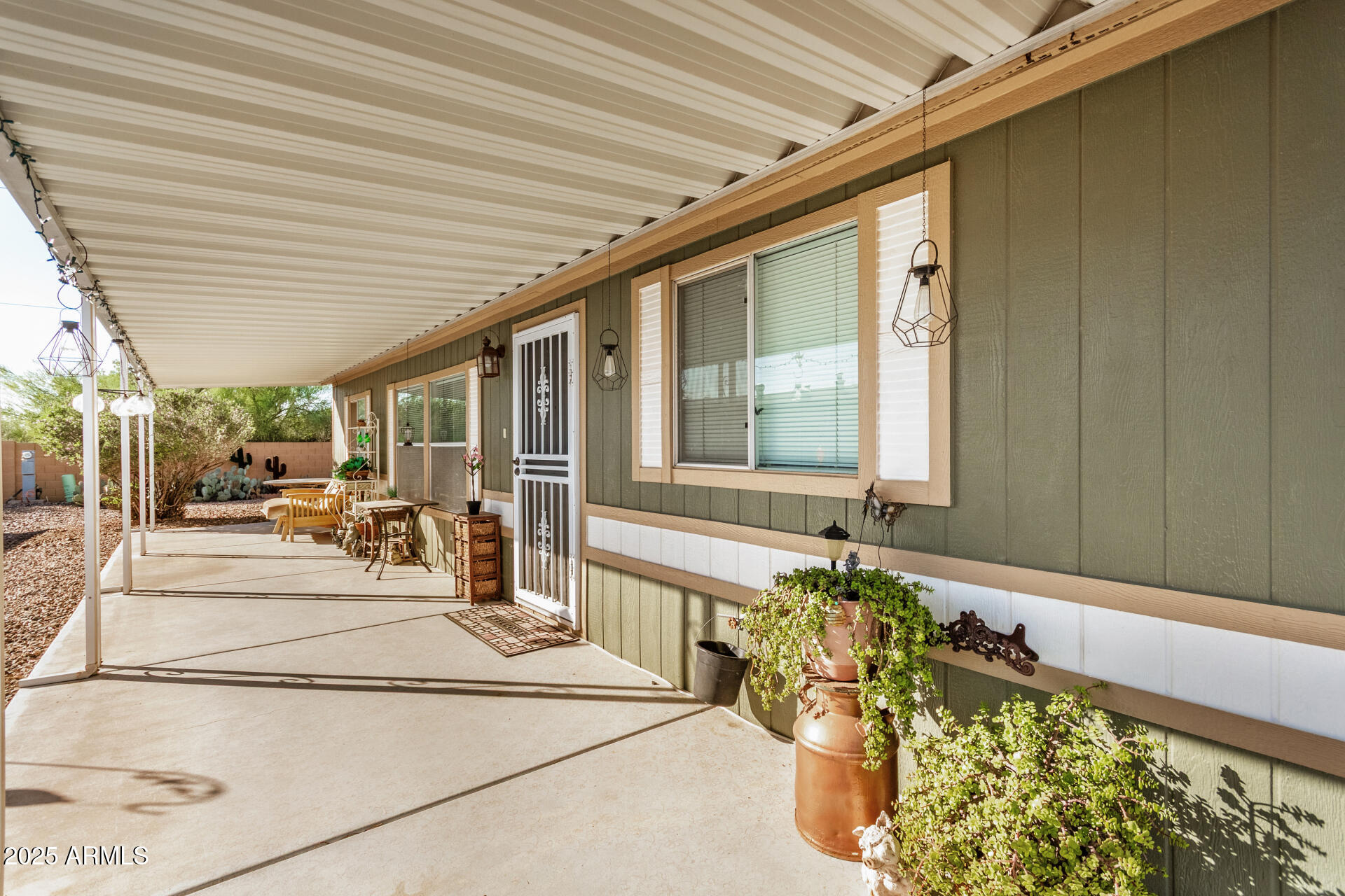 2208 West Baseline Avenue, Unit 114 Apache Junction, AZ 85120 - Photo 25 of 28 a view of a chairs and table in a patio