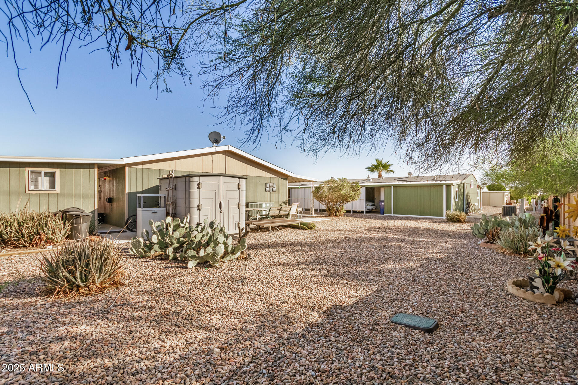2208 West Baseline Avenue, Unit 114 Apache Junction, AZ 85120 - Photo 27 of 28 a front view of a house with garden