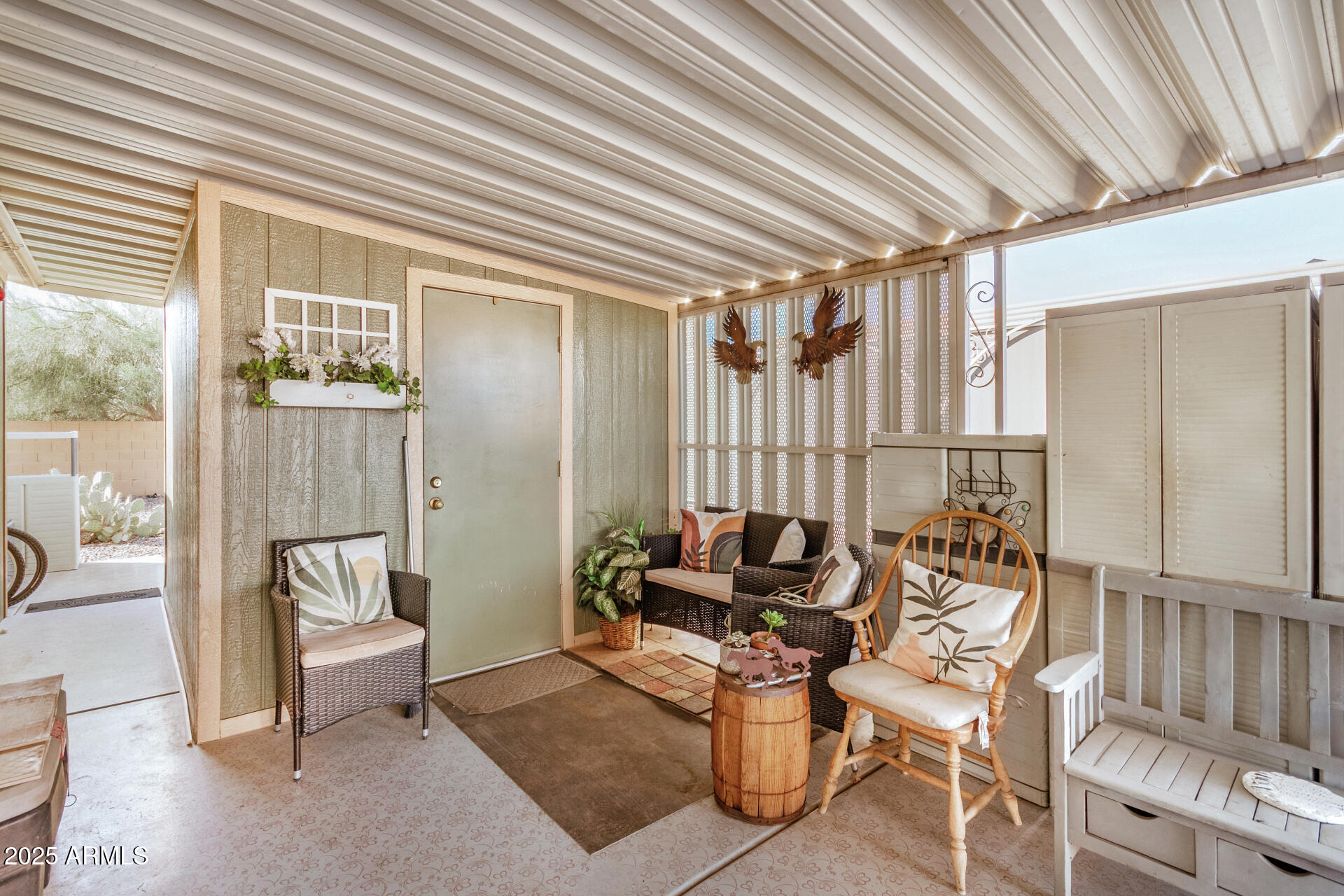 2208 West Baseline Avenue, Unit 114 Apache Junction, AZ 85120 - Photo 7 of 28 a living room with furniture and a floor to ceiling window