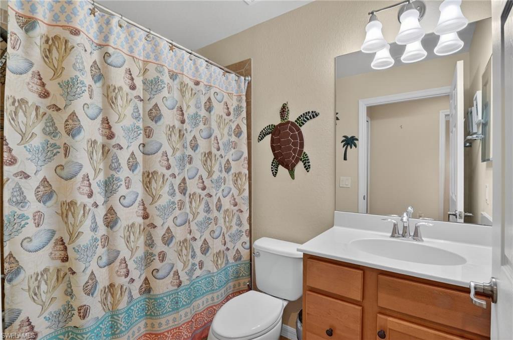 9513 Avellino Way, Unit 2014 Naples, FL 34113 - Photo 18 of 41 a bathroom with a sink toilet and shower