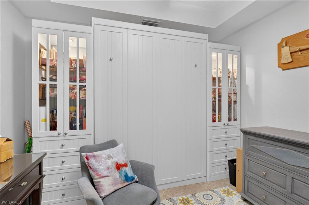 9513 Avellino Way, Unit 2014 Naples, FL 34113 - Photo 21 of 41 a living room with furniture