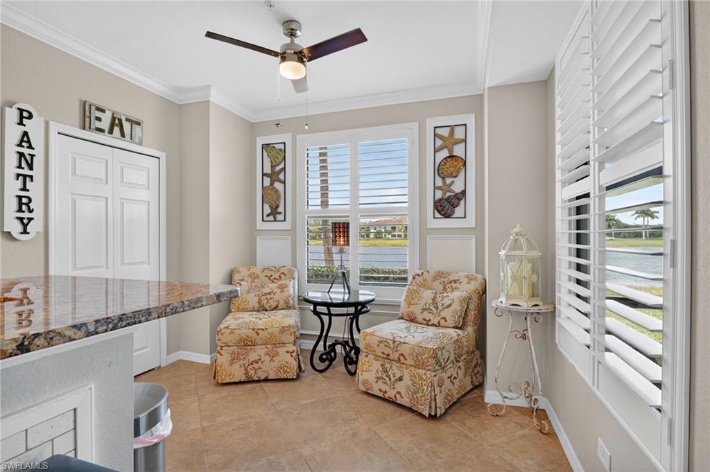 9513 Avellino Way, Unit 2014 Naples, FL 34113 - Photo 22 of 41 a living room with furniture and a large window