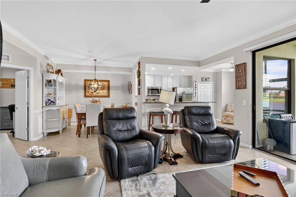 9513 Avellino Way, Unit 2014 Naples, FL 34113 - Photo 29 of 41 a living room with furniture and a window