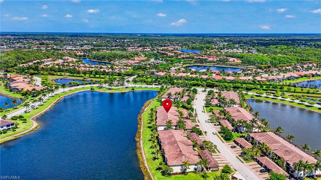9513 Avellino Way, Unit 2014 Naples, FL 34113 - Photo 34 of 41 an aerial view of a house with a swimming pool outdoor seating and yard