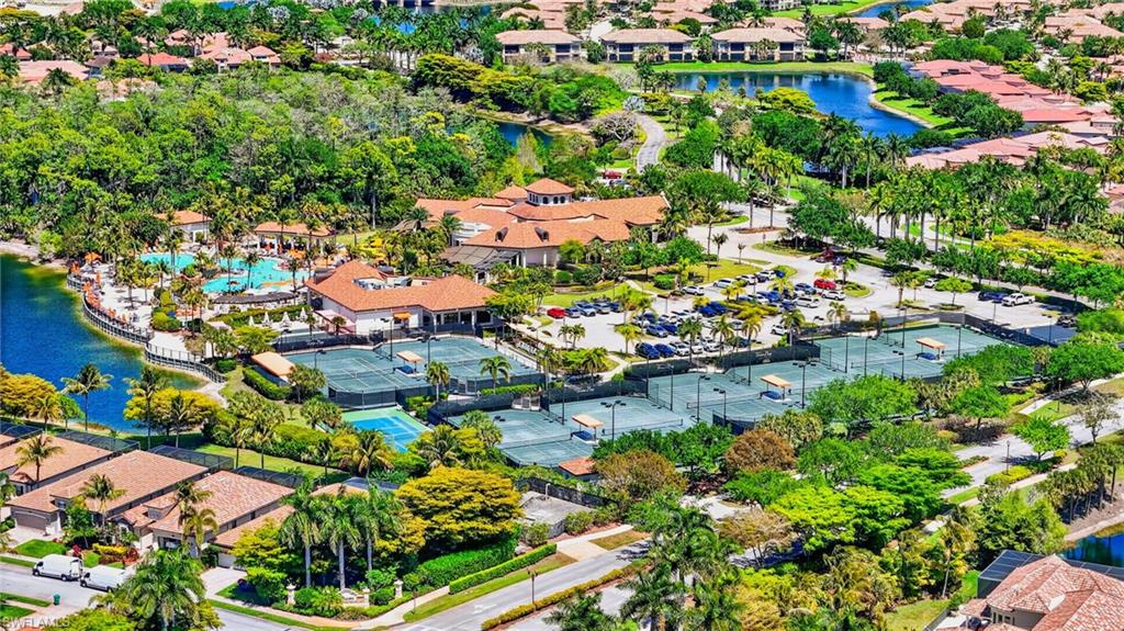 9513 Avellino Way, Unit 2014 Naples, FL 34113 - Photo 35 of 41 an aerial view of residential houses with outdoor space and trees