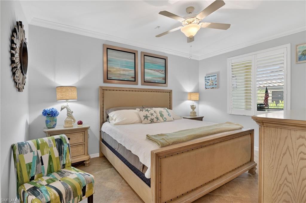 9513 Avellino Way, Unit 2014 Naples, FL 34113 - Photo 4 of 41 a bedroom with a bed and window
