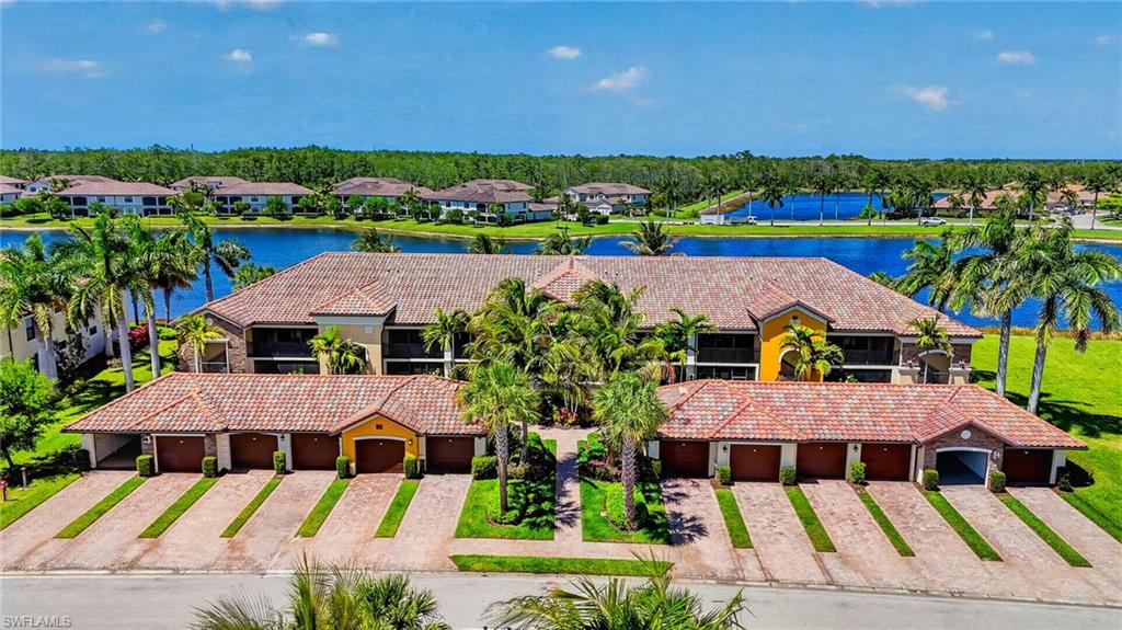 9513 Avellino Way, Unit 2014 Naples, FL 34113 - Photo 8 of 41 an aerial view of residential houses with outdoor space and swimming pool