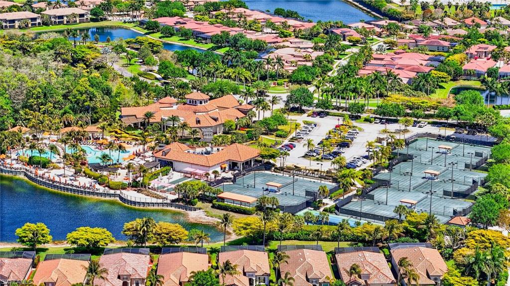 9513 Avellino Way, Unit 2014 Naples, FL 34113 - Photo 10 of 41 an aerial view of residential houses with outdoor space and swimming pool