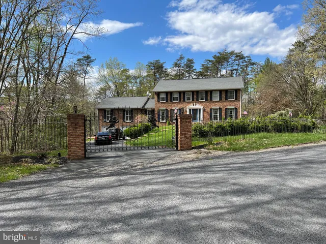 a view of a house next to a yard